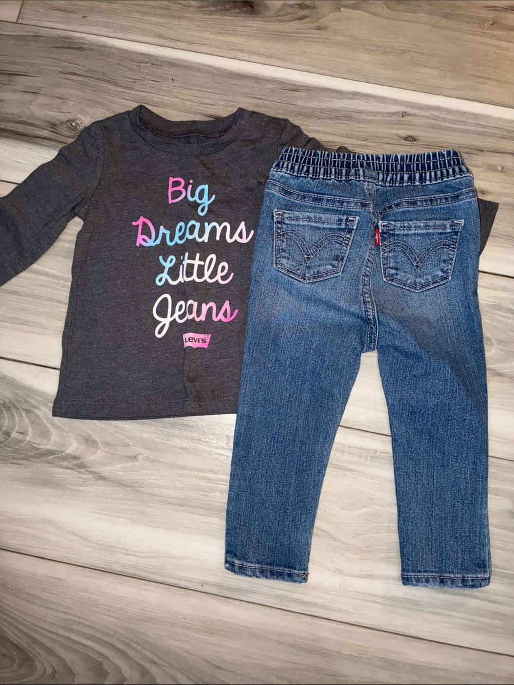 🩵 Levi's Charcoal Top with Multicolor Script & Blue Jeans Set